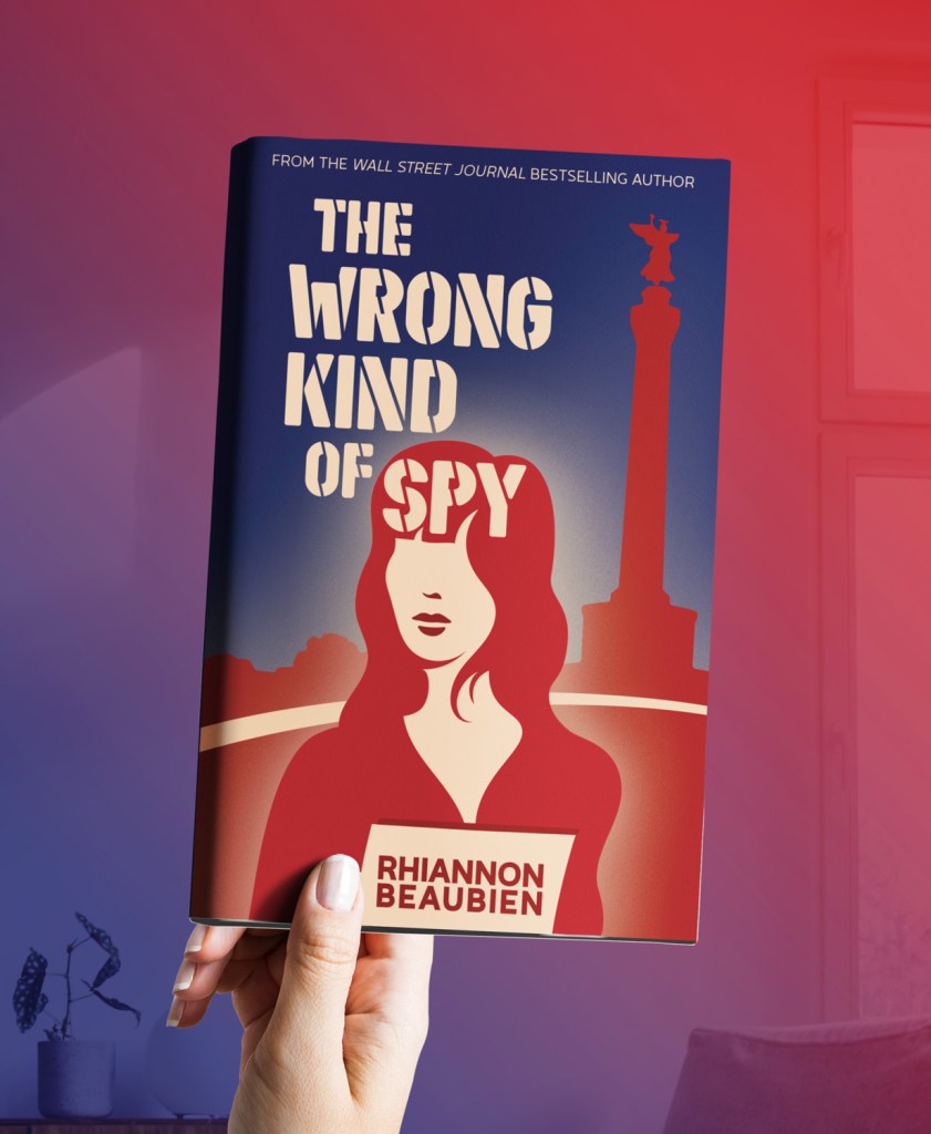 Illustrated cover for The Wrong Kind of Spy by Rhiannon Beaubien. Shows a stylized woman holding a dossier, standing in front of the Tiergarten in Berlin. The composition suggests Cold War tension through graphic simplicity and muted tones.